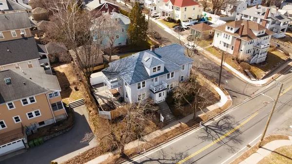 an aerial view of a house with outdoor space