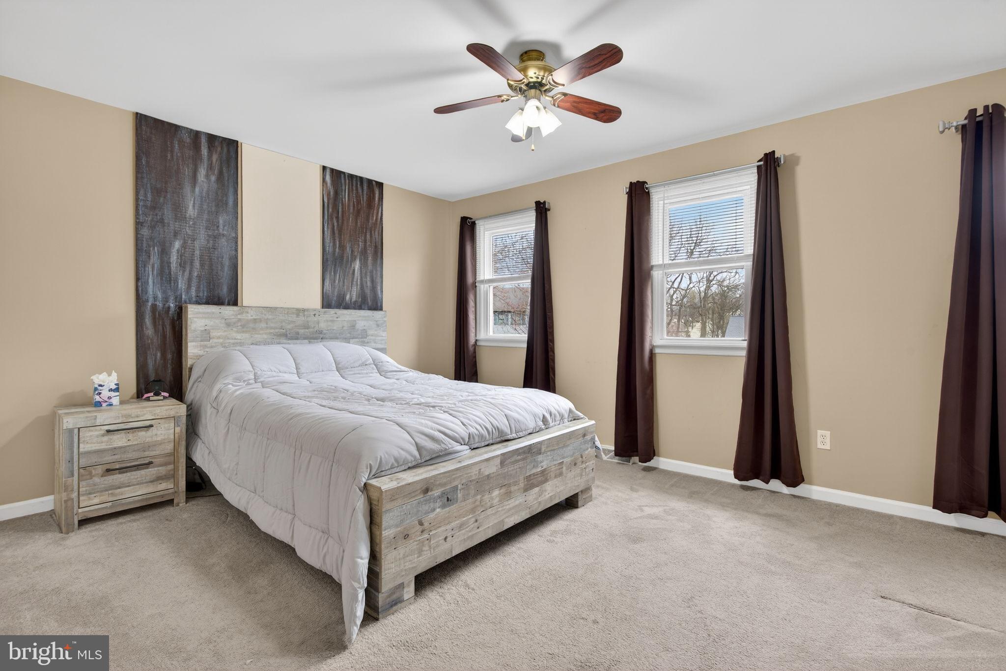 64 Beech Lane Elizabethtown, PA 17022 - Photo 12 of 26 a bedroom with a large bed and a chandelier