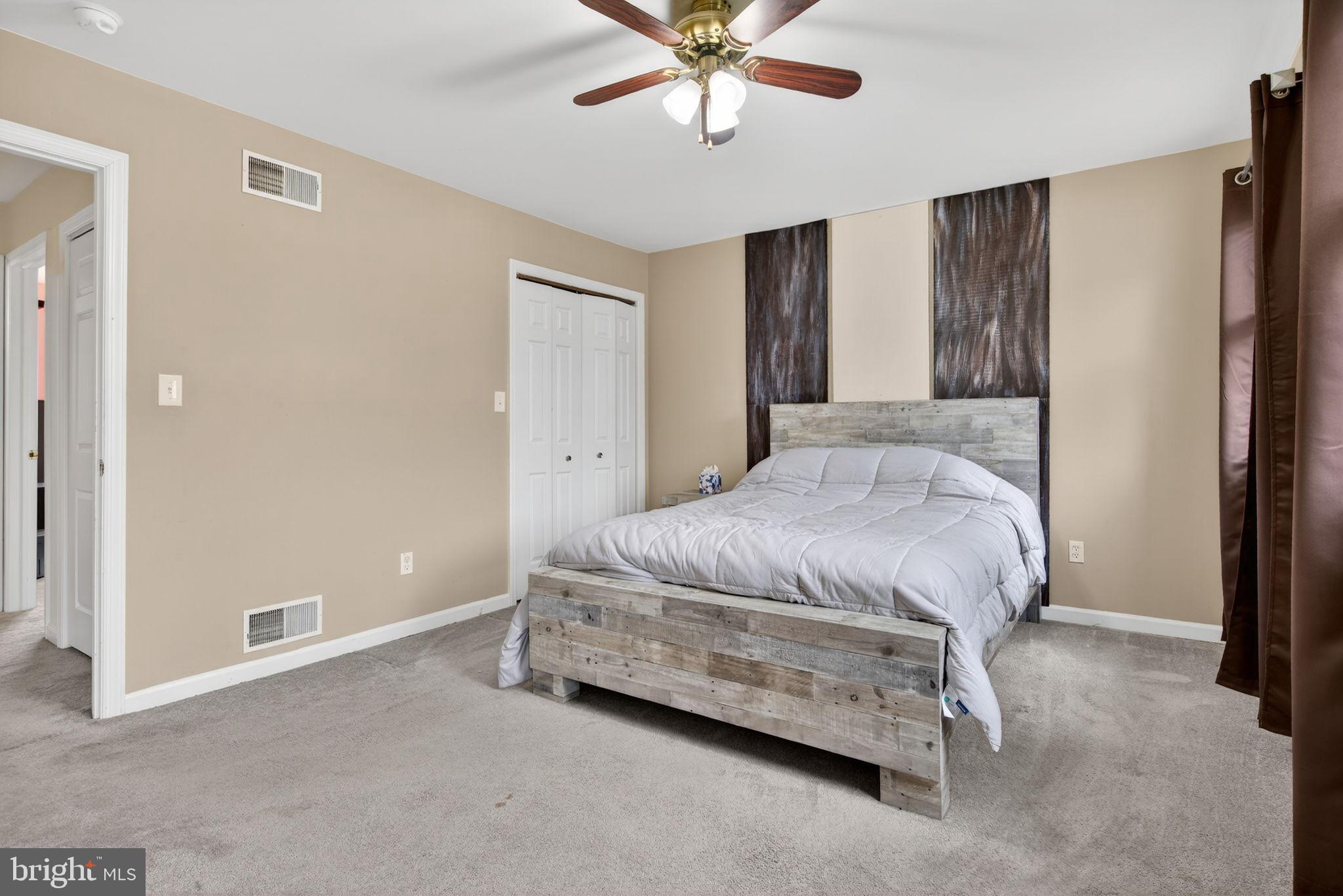 64 Beech Lane Elizabethtown, PA 17022 - Photo 13 of 26 a bedroom with a bed and a chandelier