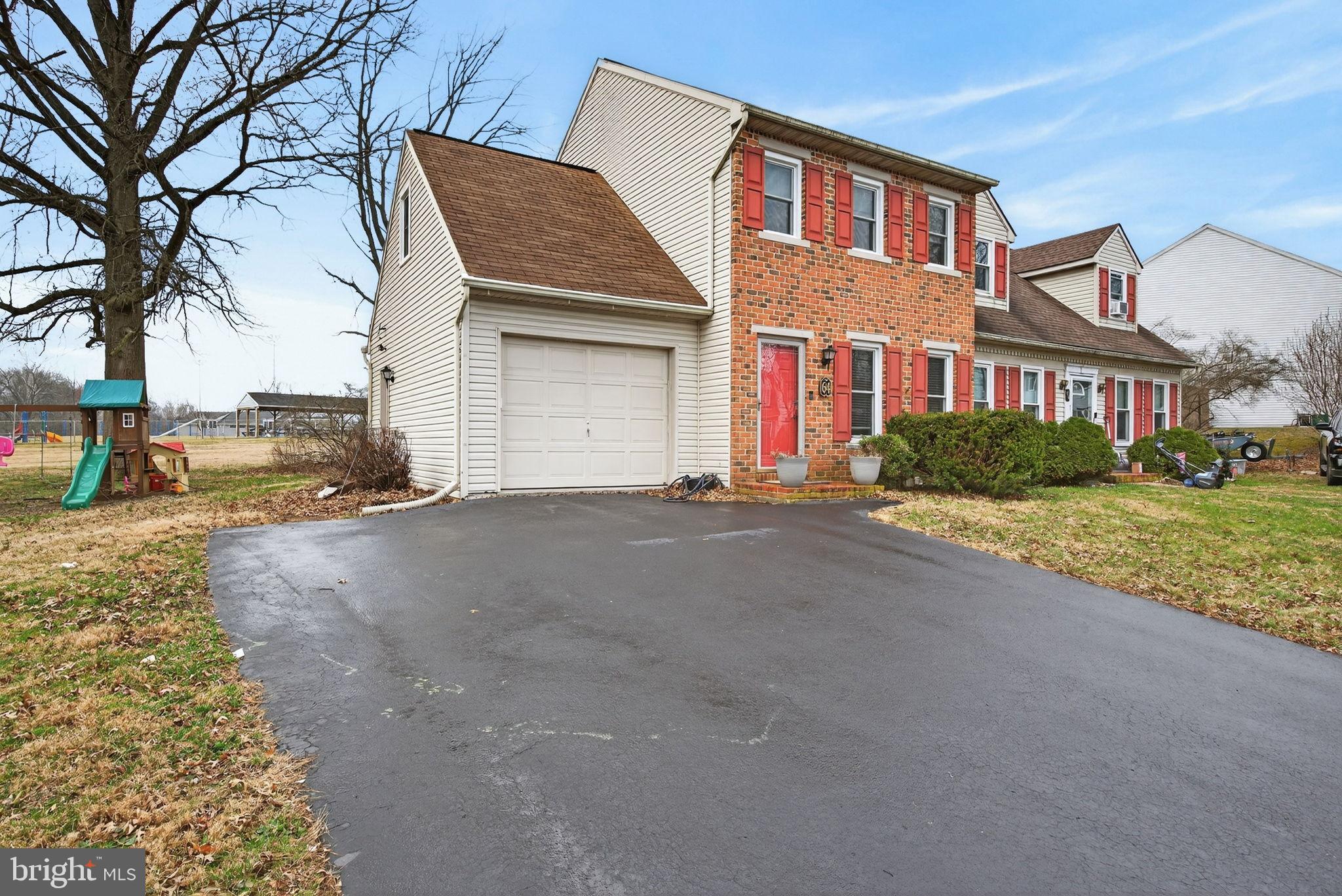 64 Beech Lane Elizabethtown, PA 17022 - Photo 2 of 26 a front view of a house with a yard