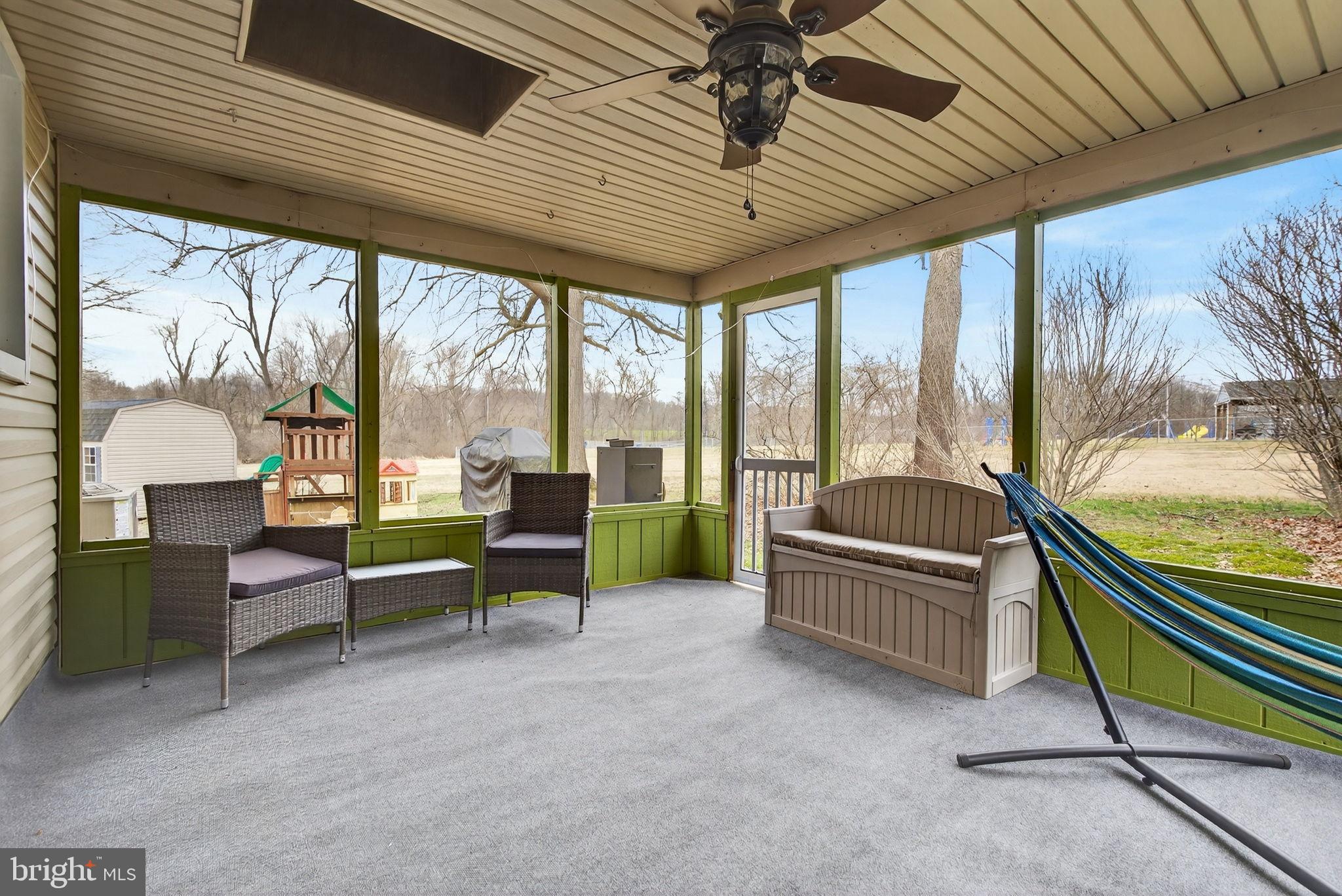 64 Beech Lane Elizabethtown, PA 17022 - Photo 21 of 26 a living room with furniture and a floor to ceiling window