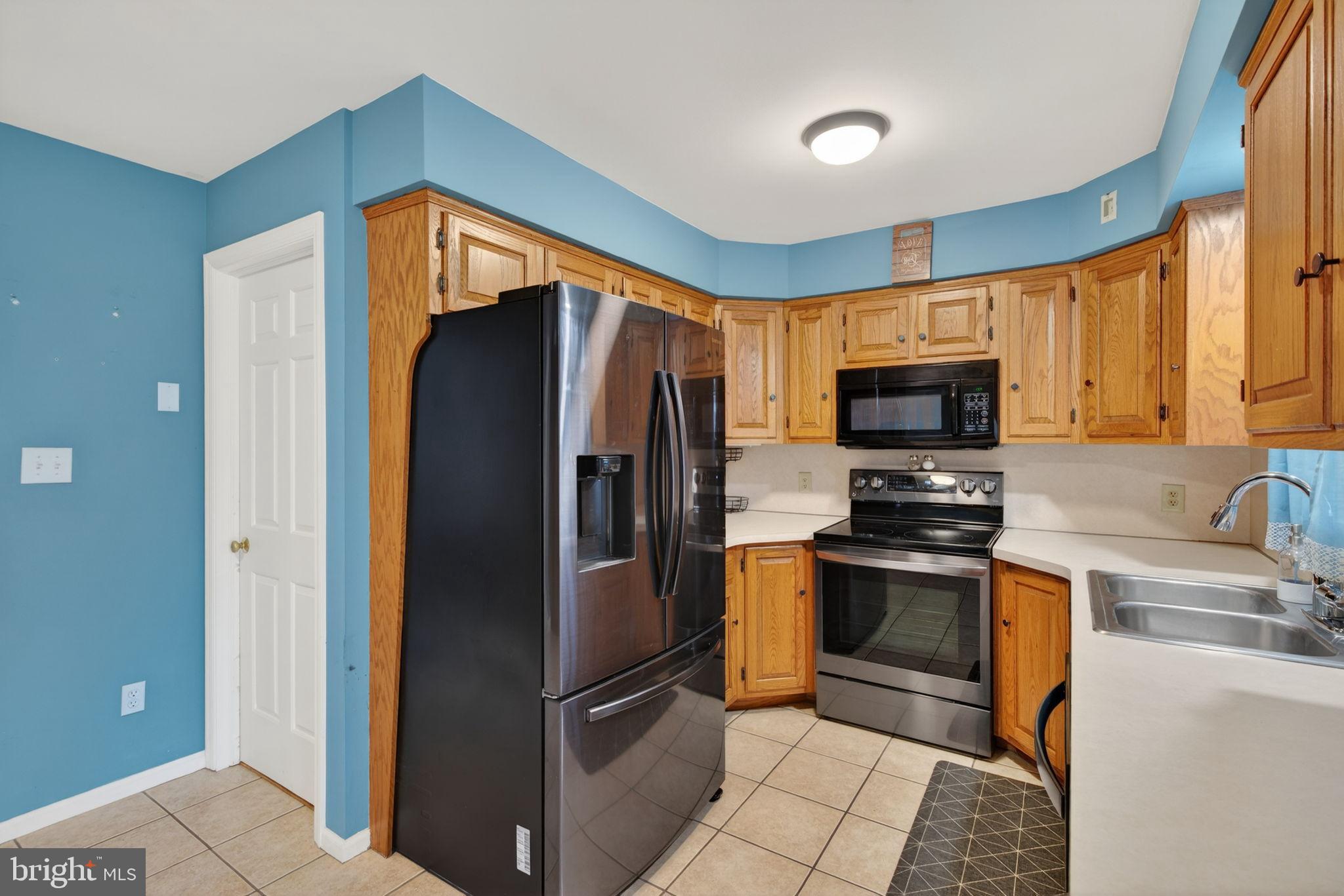 64 Beech Lane Elizabethtown, PA 17022 - Photo 8 of 26 a kitchen with stainless steel appliances granite countertop a refrigerator a stove top oven a sink and dishwasher