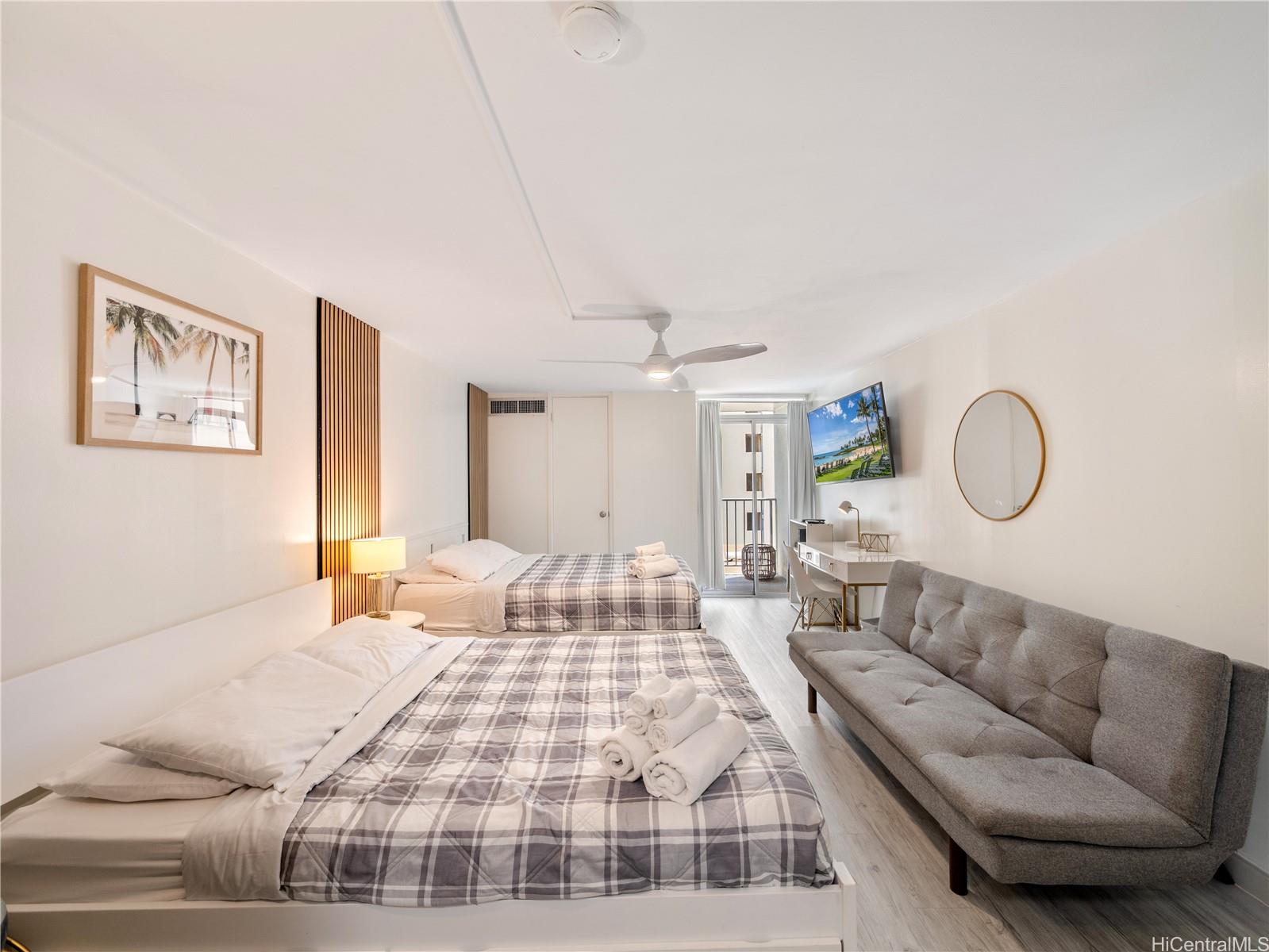2572 Lemon Road, Unit 610 Honolulu, HI 96815 - Photo 10 of 24 a bedroom with a large bed and a couch