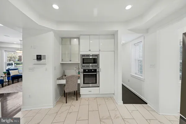 a spacious bedroom with a bed and a window