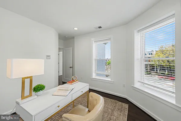 a bathroom with a sink mirror and shower