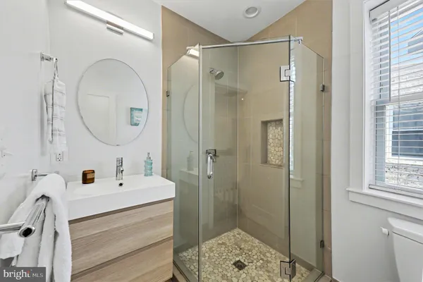 an empty room with wooden floor and closet