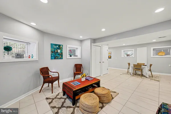 a kitchen with white cabinets a refrigerator and a stove