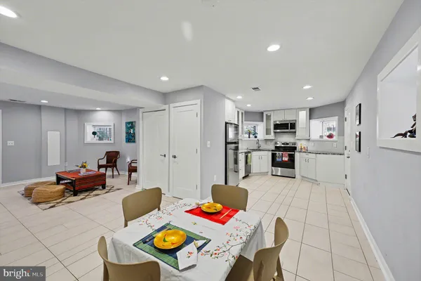 a kitchen with stainless steel appliances granite countertop a sink stove and microwave