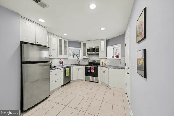 a bathroom with a toilet a sink and a mirror