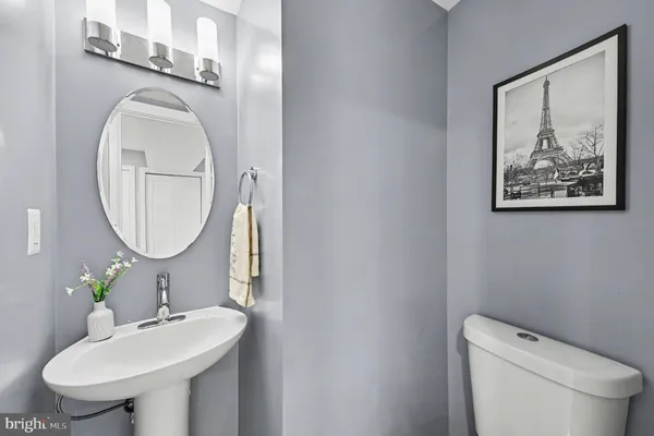 a view of hallway with wooden floor