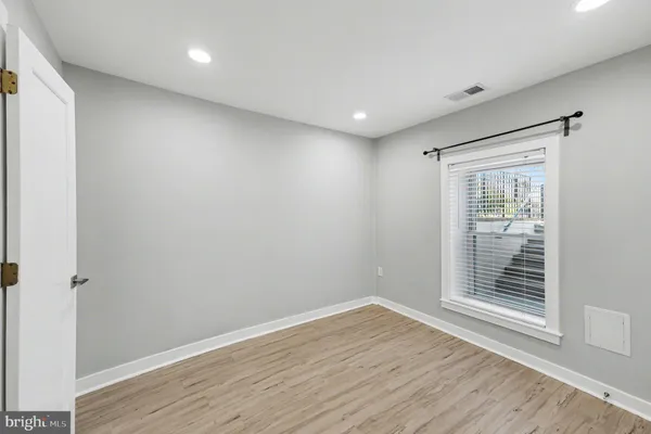 a bathroom with a bathtub sink mirror and vanity