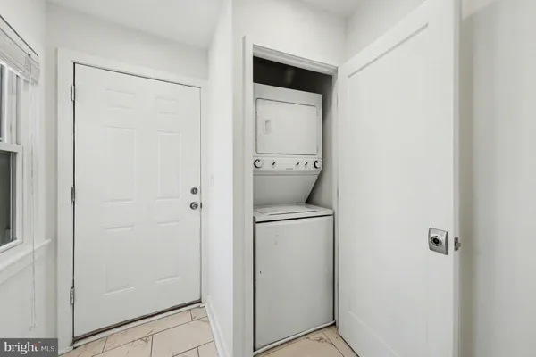 a view of a house with street from a balcony