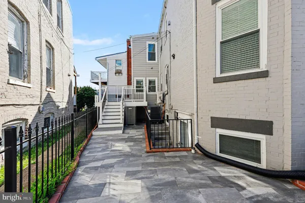 a view of a street with sitting area