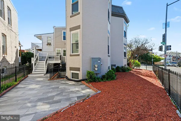 a view of a house with a tree in a yard