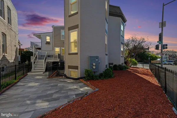 a front view of a building with street view