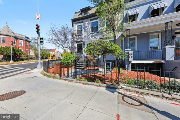 a front view of a building with street view