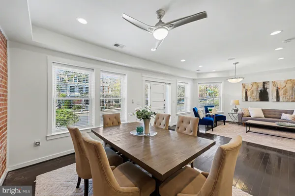 a view of a dining room with furniture window and wooden floor