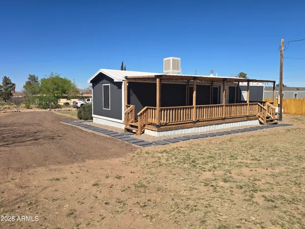 a house view with a backyard space