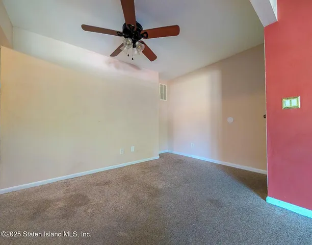 a view of a big room with a fan