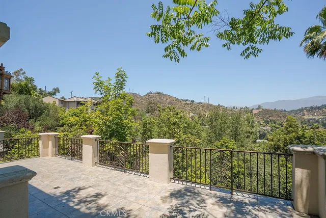 a view of a balcony with plants