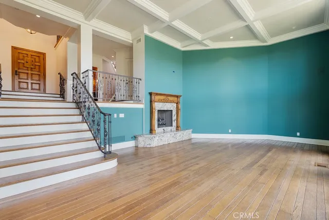 a view of an entryway with wooden floor and stairs