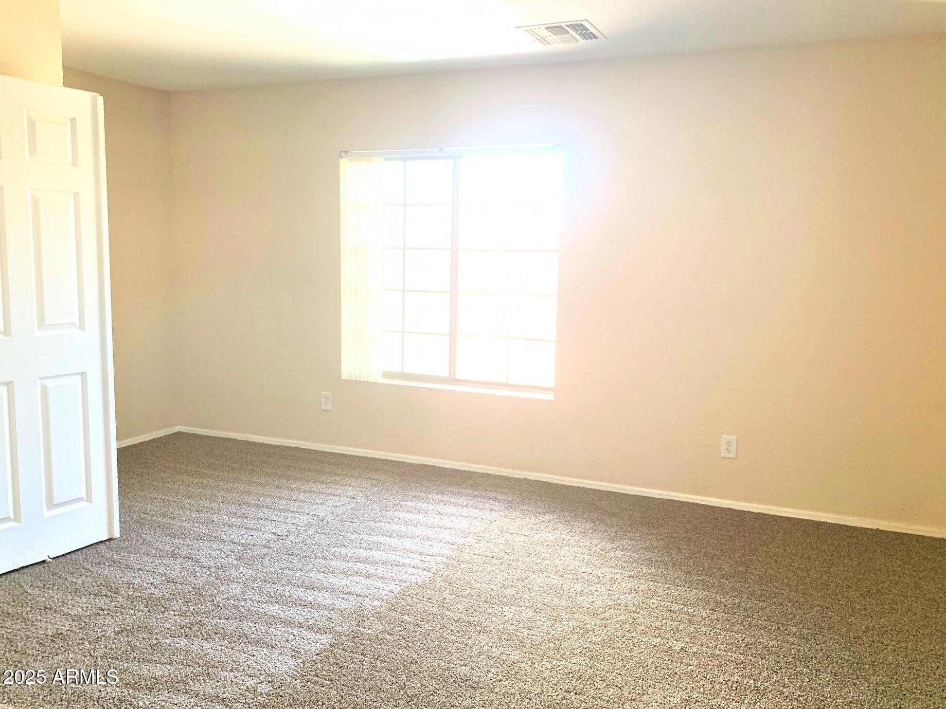 6698 East Summerset Road Florence, AZ 85132 - Photo 12 of 16 an empty room with a window
