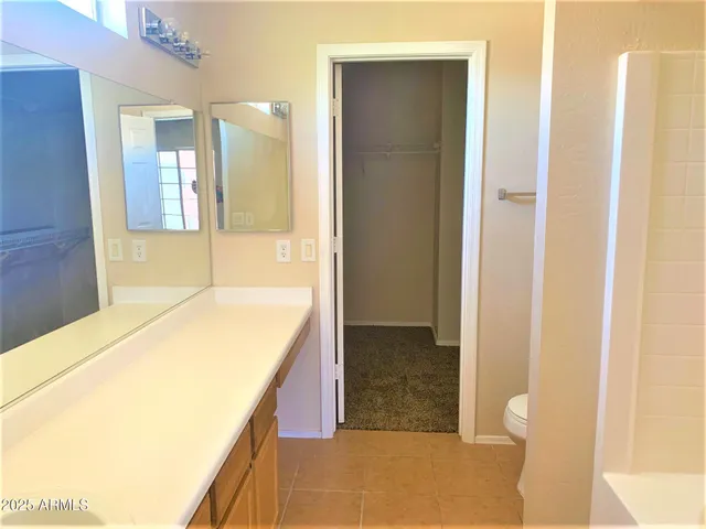 a spacious bathroom with a tub and shower