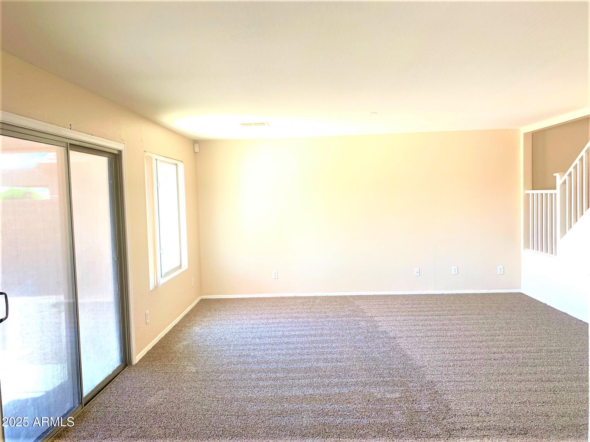 6698 East Summerset Road Florence, AZ 85132 - Photo 4 of 16 a view of an empty room and window