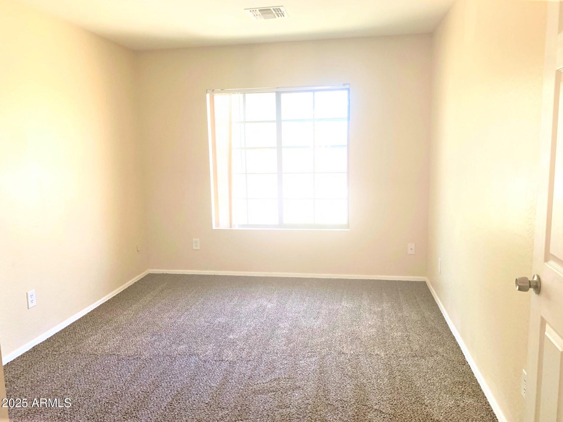 6698 East Summerset Road Florence, AZ 85132 - Photo 6 of 16 an empty room with a window