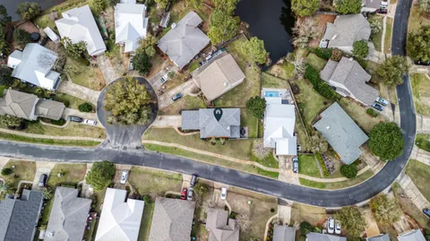 an aerial view of a house with swimming pool