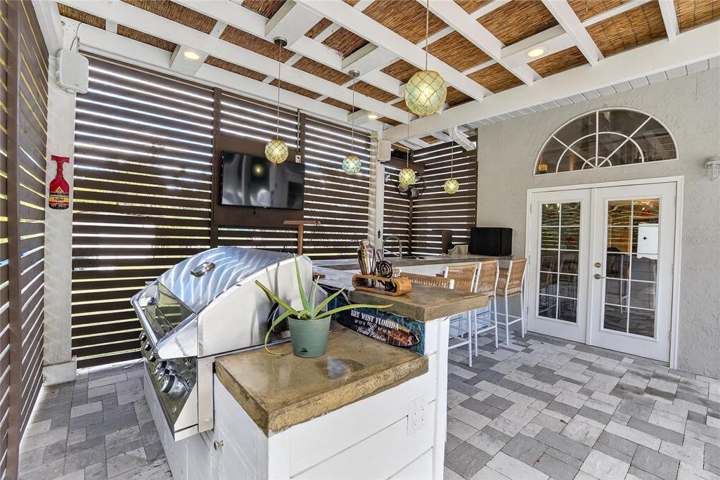 3309 Timberlee Road Wimauma, FL 33598 - Photo 30 of 56 a view of a porch with a table and chairs