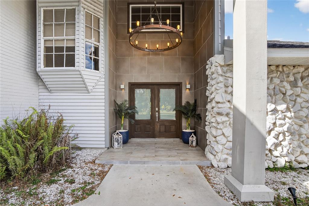 3309 Timberlee Road Wimauma, FL 33598 - Photo 3 of 56 a front view of a house with a yard