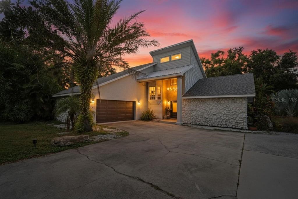 3309 Timberlee Road Wimauma, FL 33598 - Photo 43 of 56 a front view of a house with a yard and garage