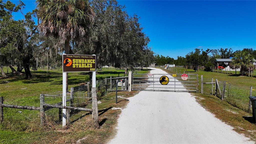 3309 Timberlee Road Wimauma, FL 33598 - Photo 52 of 56 a view of a house with backyard space and sitting area