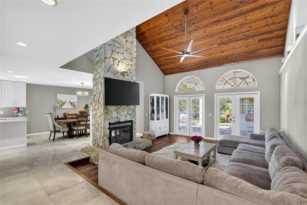 3309 Timberlee Road Wimauma, FL 33598 - Photo 6 of 56 a living room with fireplace furniture and a flat screen tv