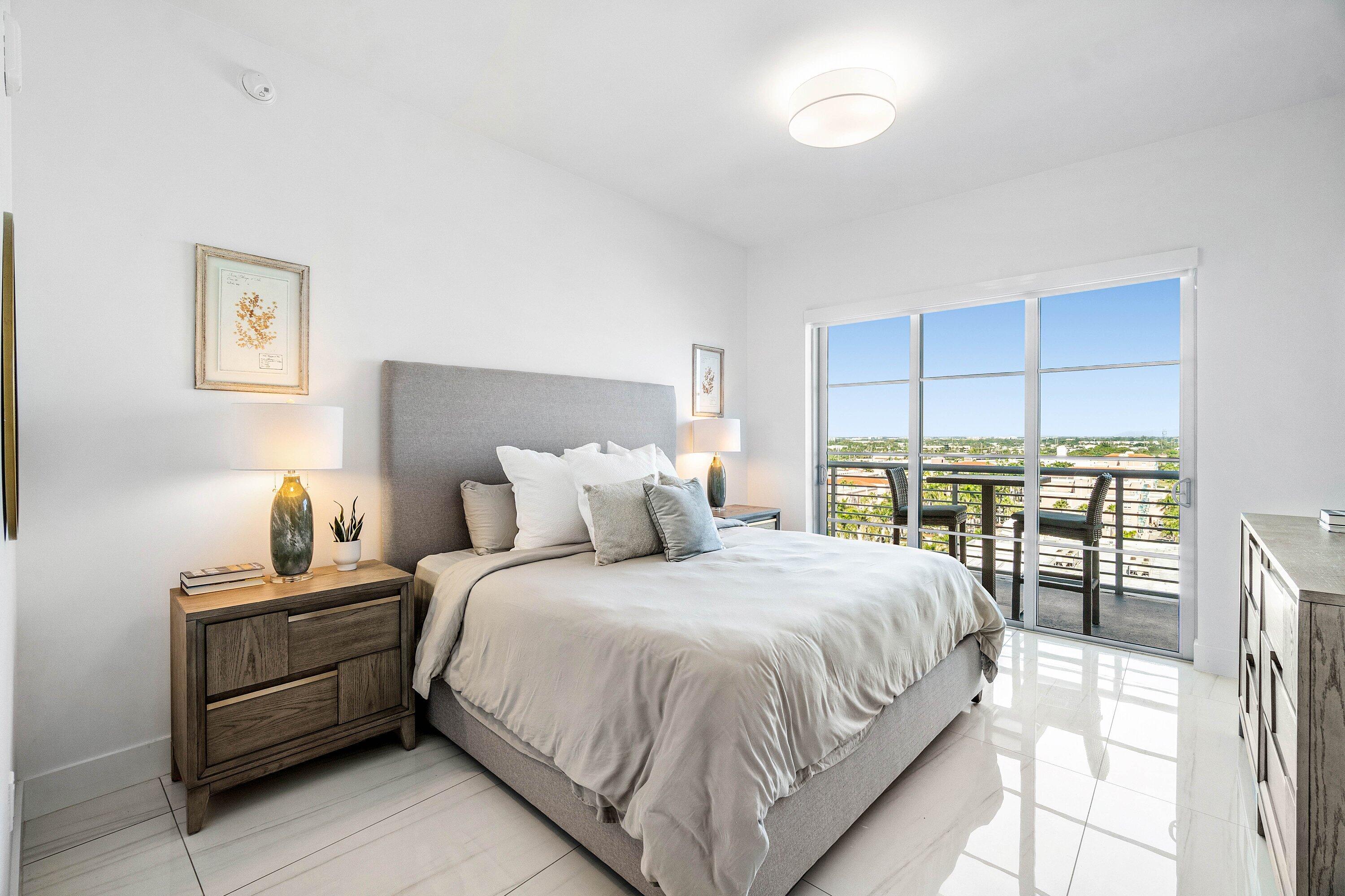 155 East Boca Raton Road, Unit 1119 Boca Raton, FL 33432 - Photo 12 of 41 a bedroom with a bed and a large window