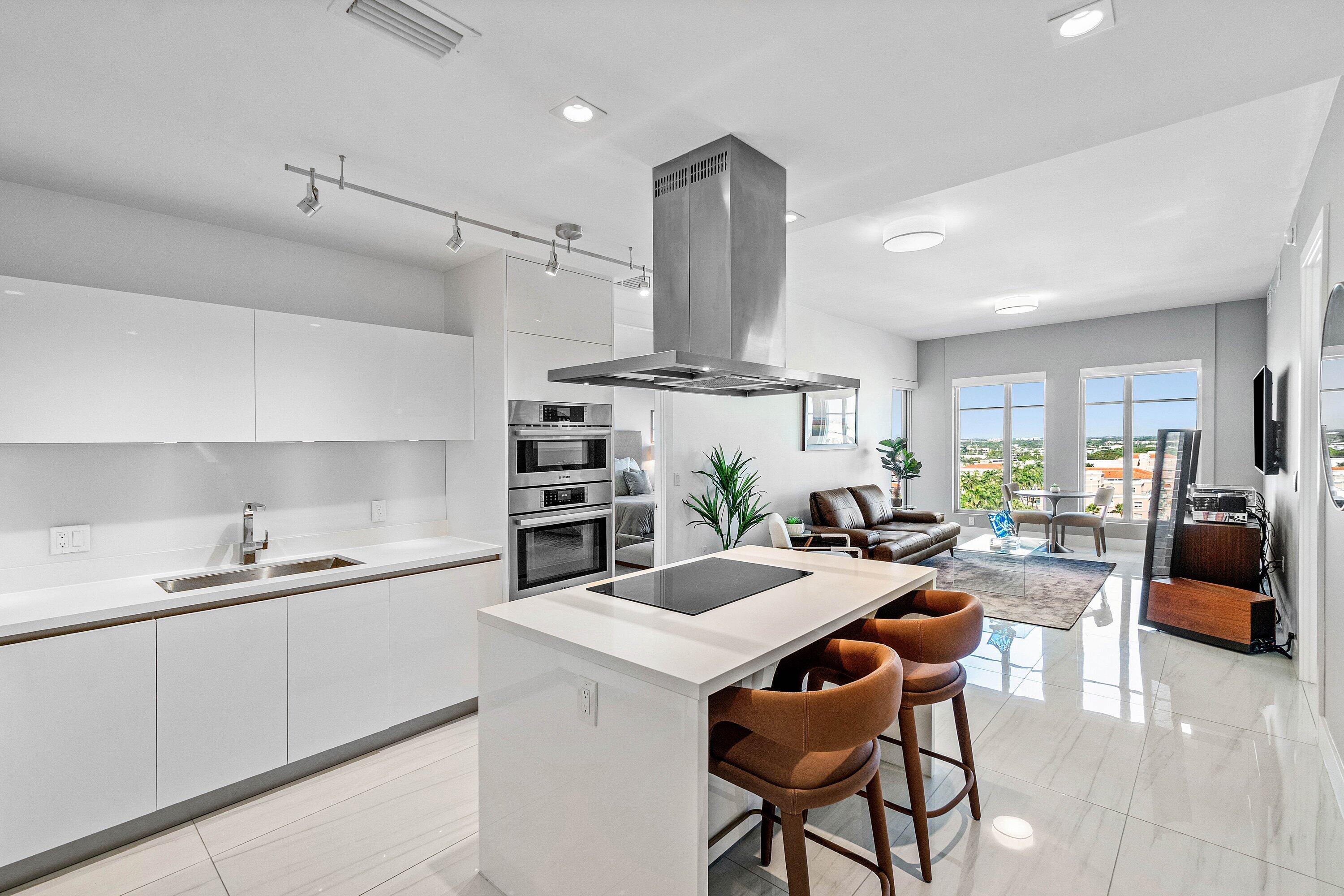155 East Boca Raton Road, Unit 1119 Boca Raton, FL 33432 - Photo 7 of 41 a kitchen with a sink a counter space appliances and cabinets