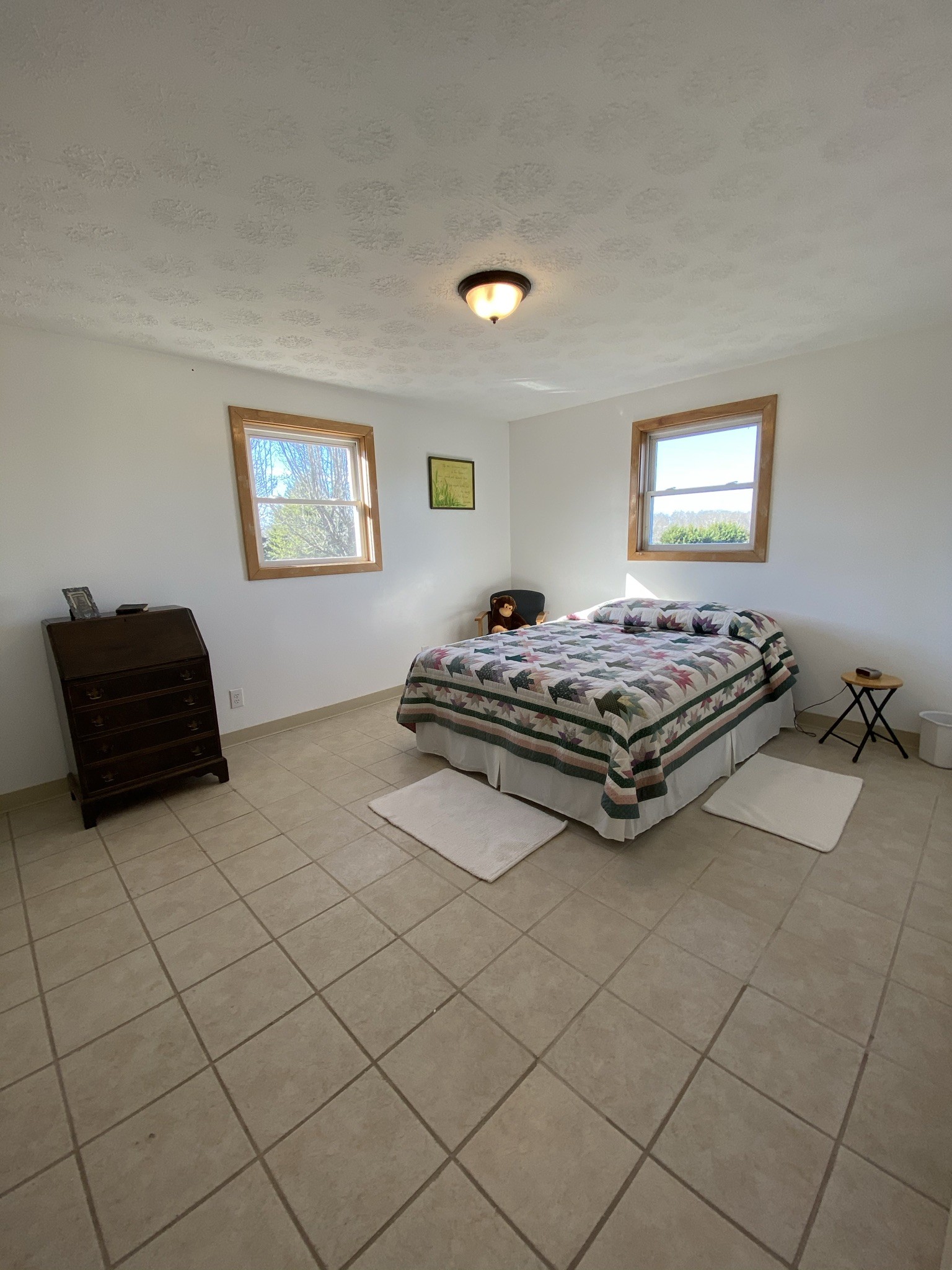 1747 Ivy Lake Road Morrison, TN 37357 - Photo 14 of 27 a bedroom with a bed and a lamp on dresser