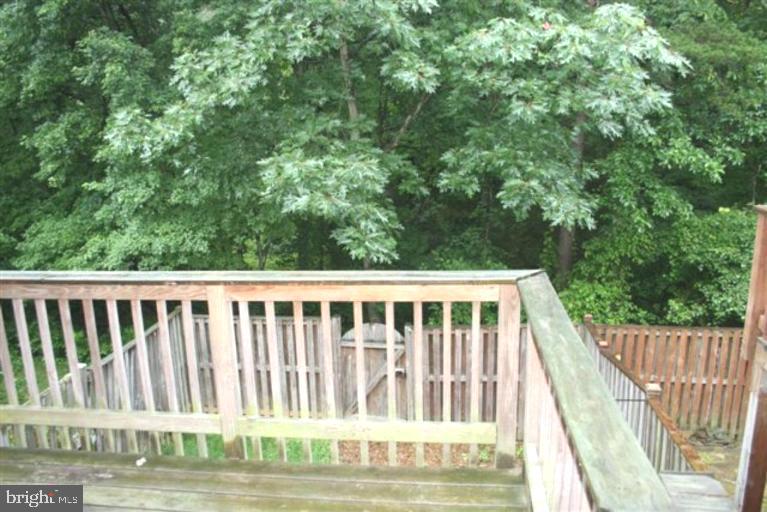 15081 Mill Spring Drive Dumfries, VA 22025 - Photo 12 of 13 a view of balcony with wooden floor and fence