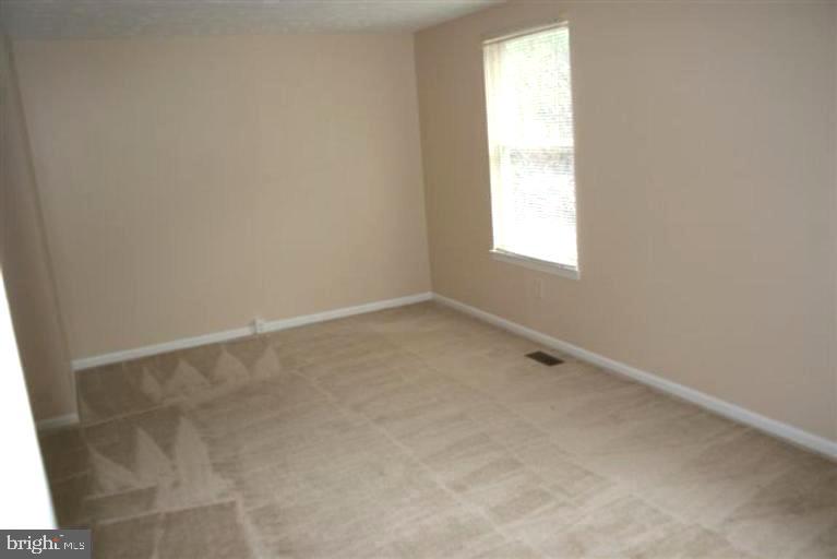 15081 Mill Spring Drive Dumfries, VA 22025 - Photo 9 of 13 an empty room with a window