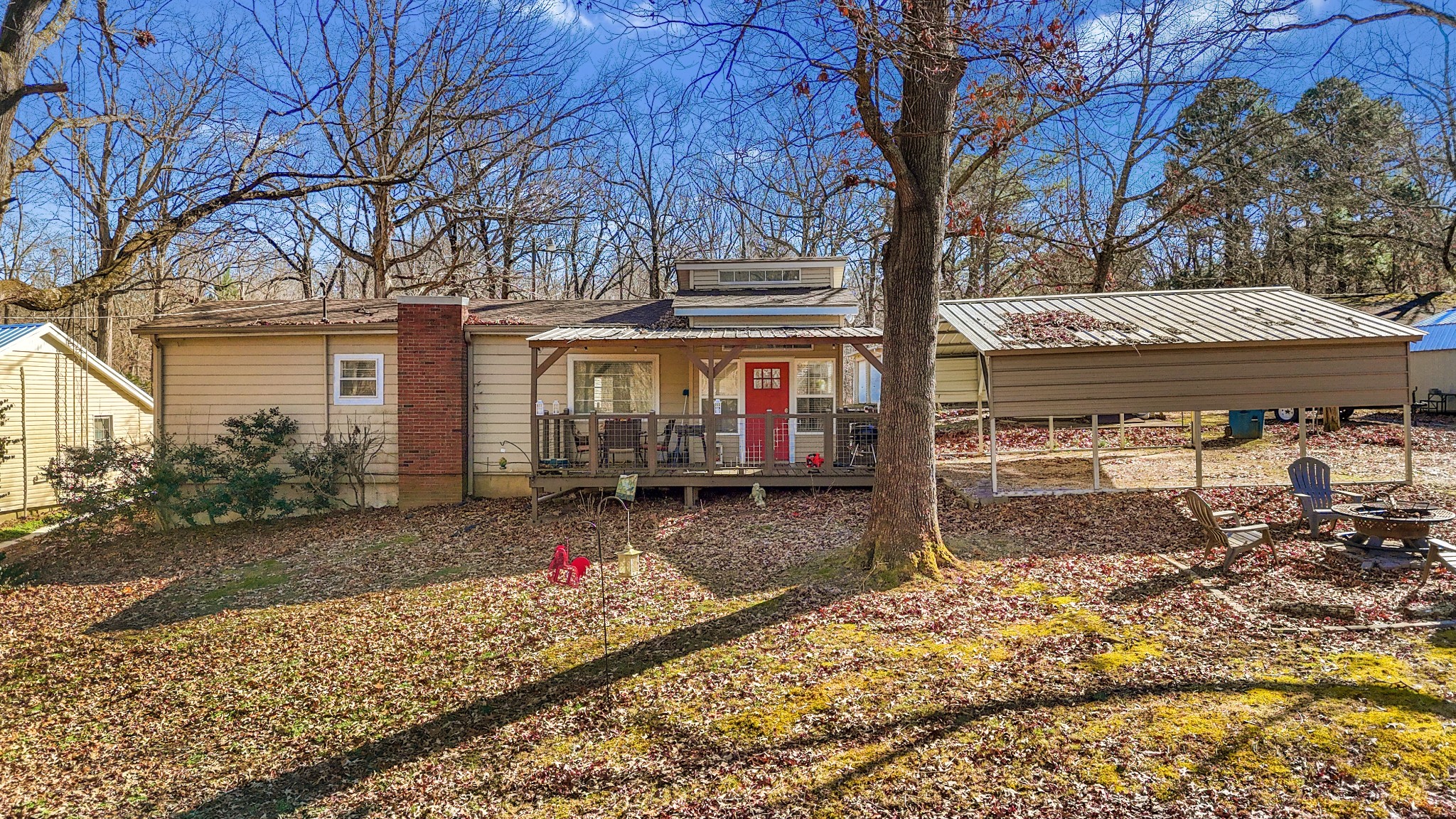 a view of a house with a yard and tree s