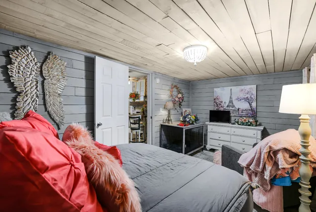 a bedroom with a bed and a closet