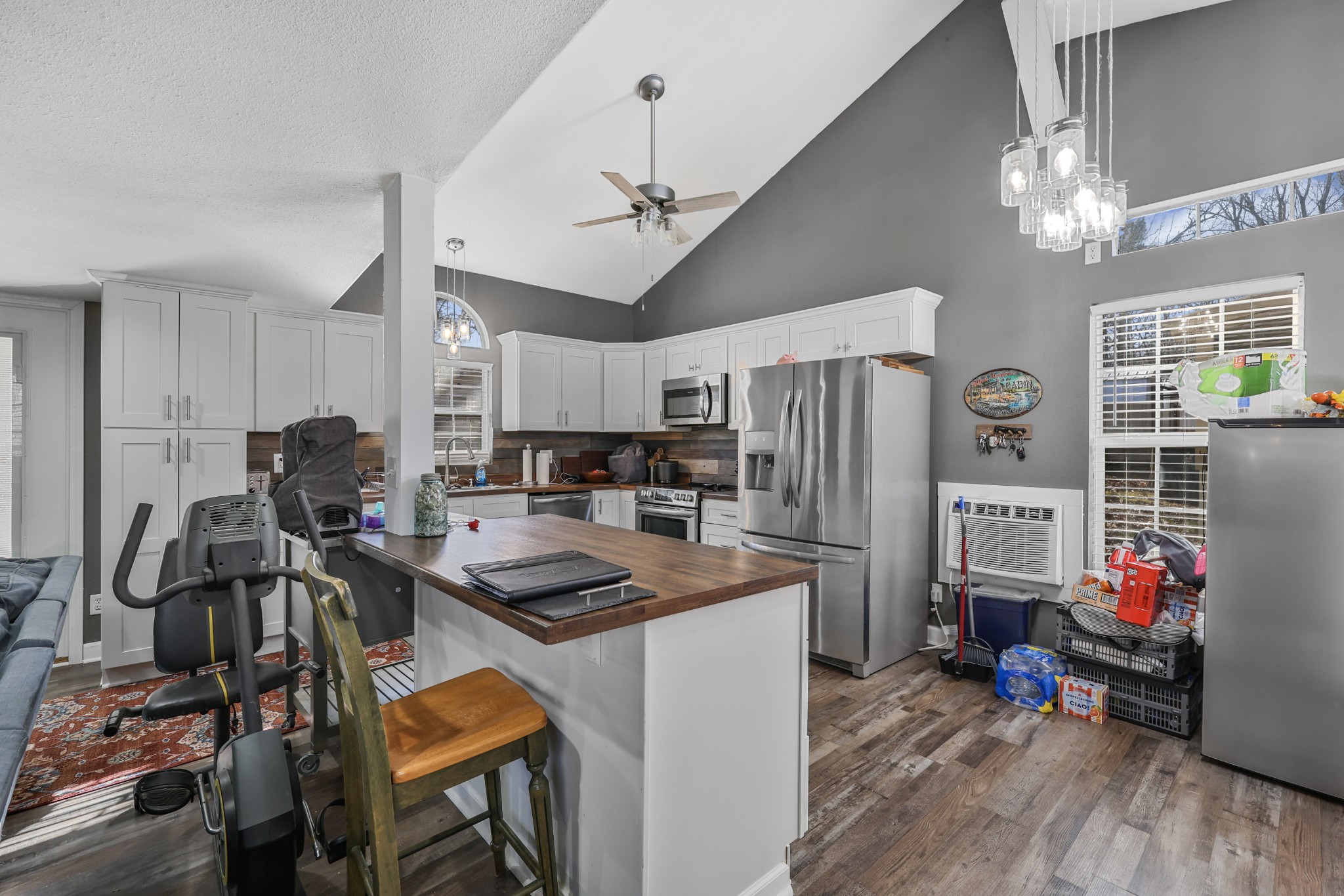 80 Woody Lane Springville, TN 38256 - Photo 26 of 31 a kitchen that has a lot of cabinets a refrigerator and a stove