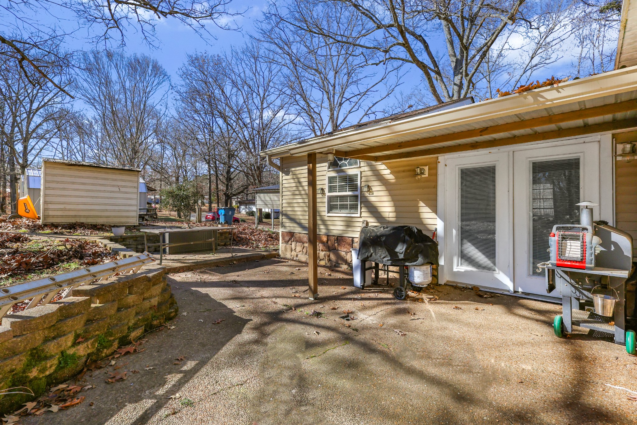 80 Woody Lane Springville, TN 38256 - Photo 28 of 31 a view of a house with backyard porch and sitting area