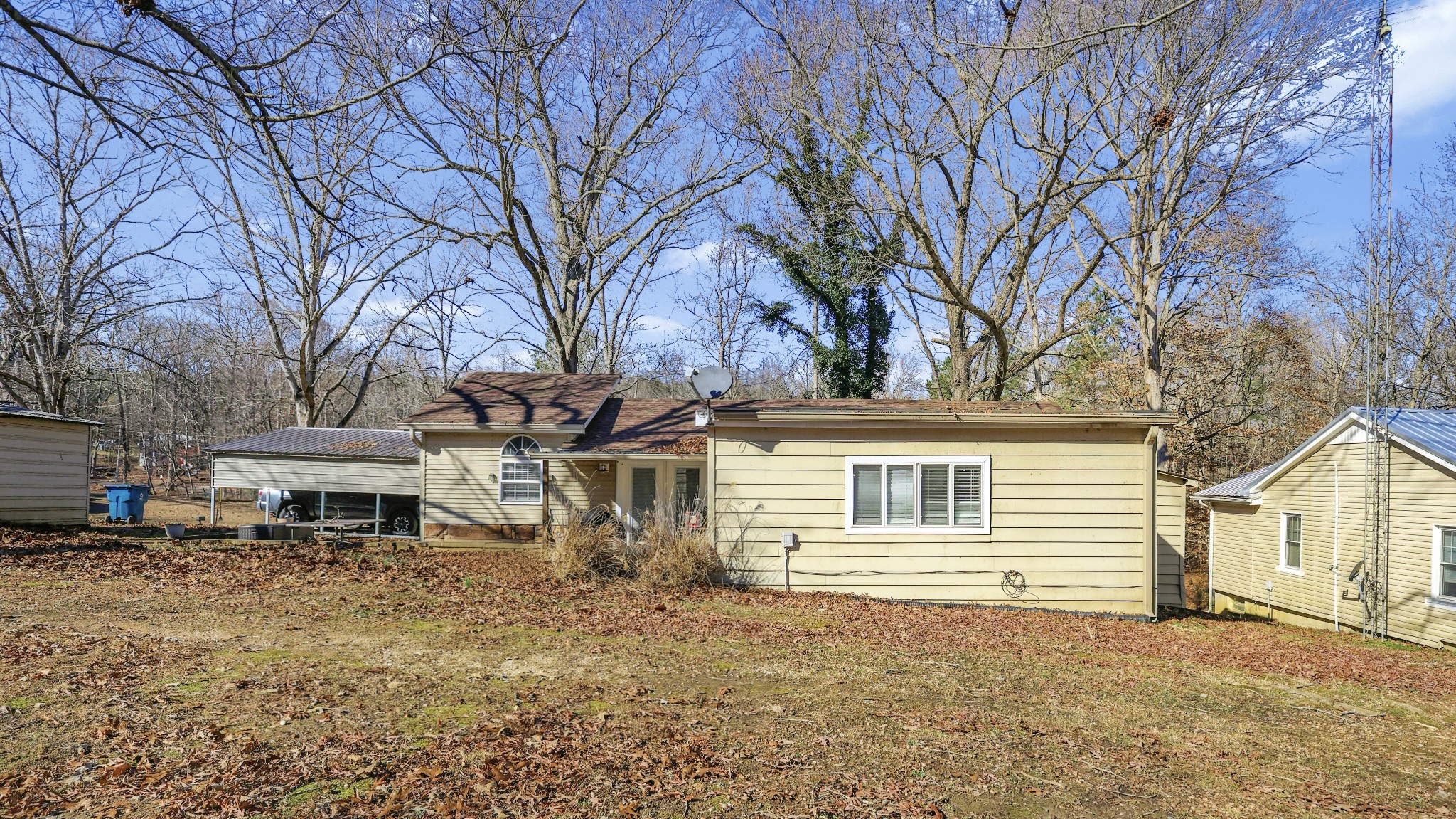 80 Woody Lane Springville, TN 38256 - Photo 31 of 31 a house that has a tree in front of it