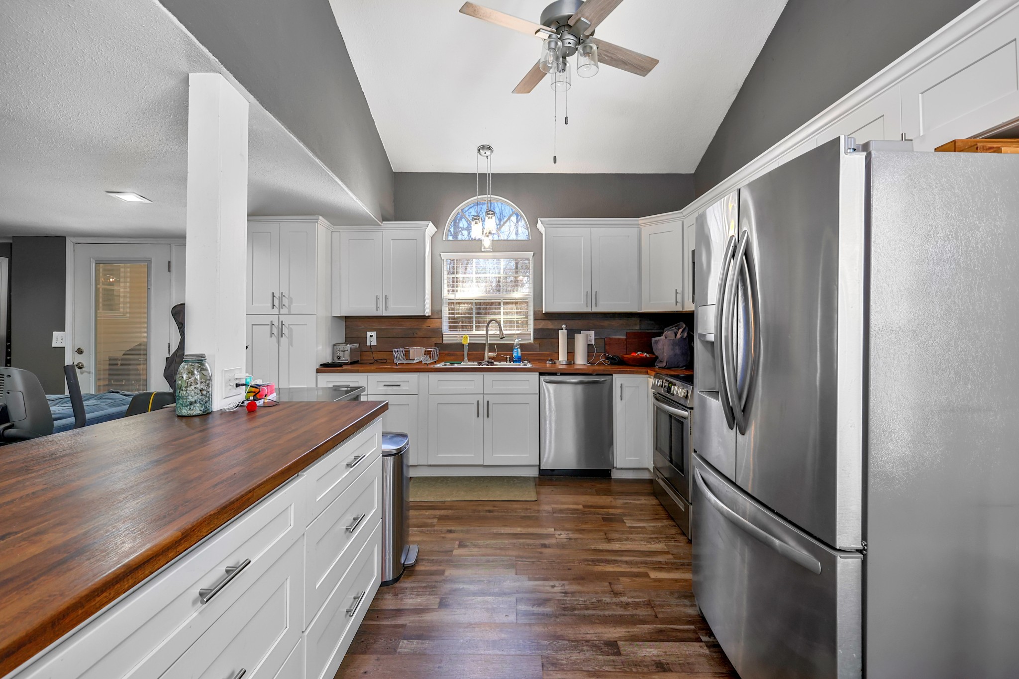 80 Woody Lane Springville, TN 38256 - Photo 6 of 31 a kitchen with a refrigerator a sink and cabinets