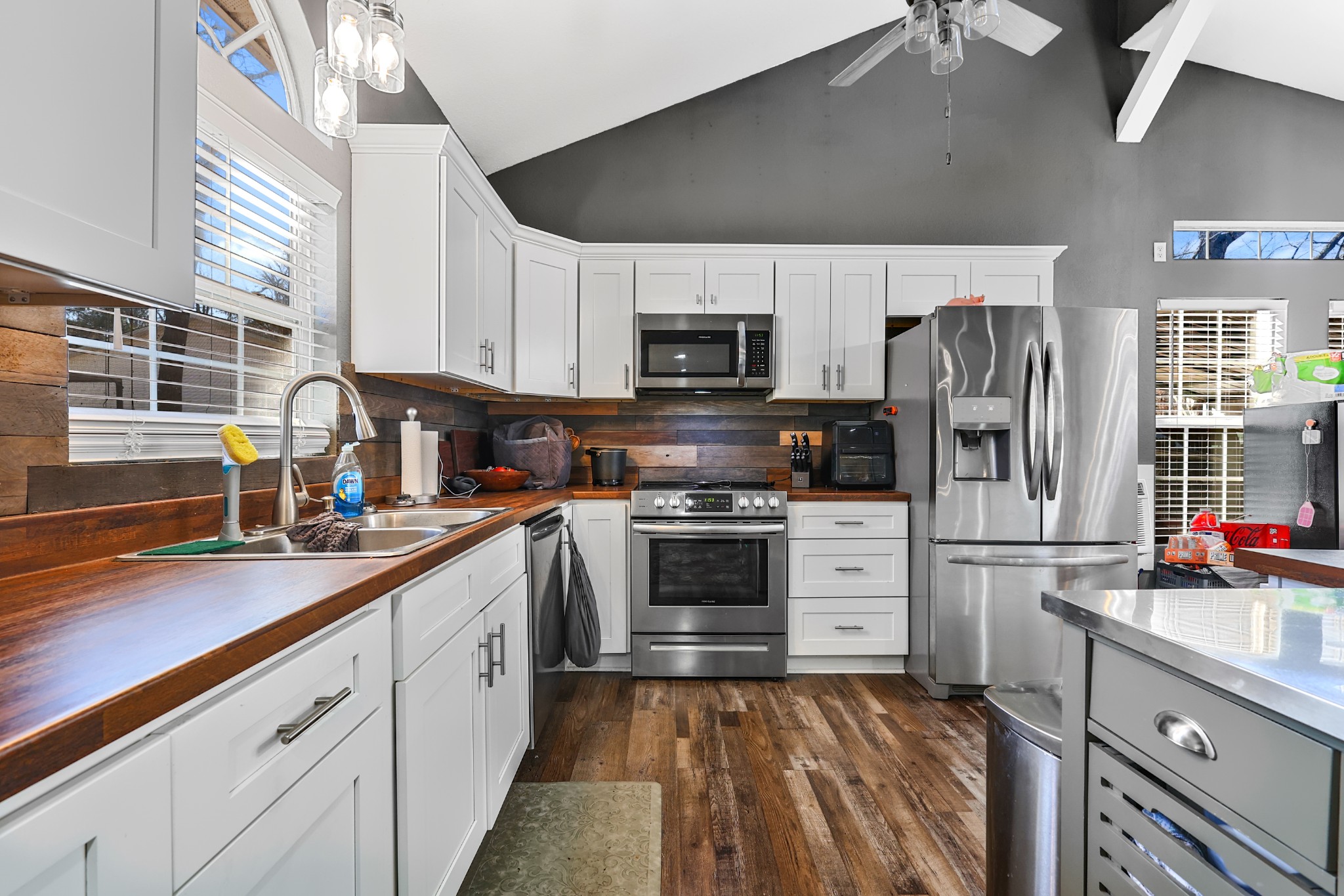 80 Woody Lane Springville, TN 38256 - Photo 7 of 31 a kitchen with stainless steel appliances a refrigerator sink and microwave
