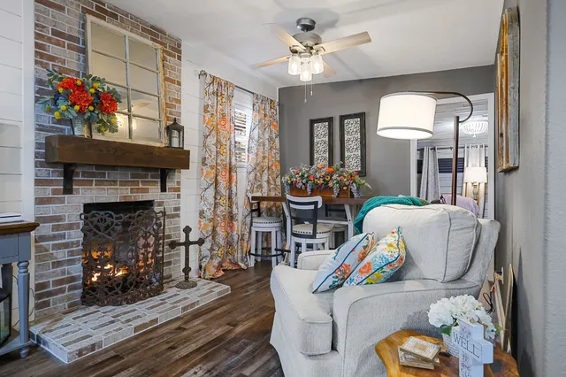 a living room with furniture and a fireplace