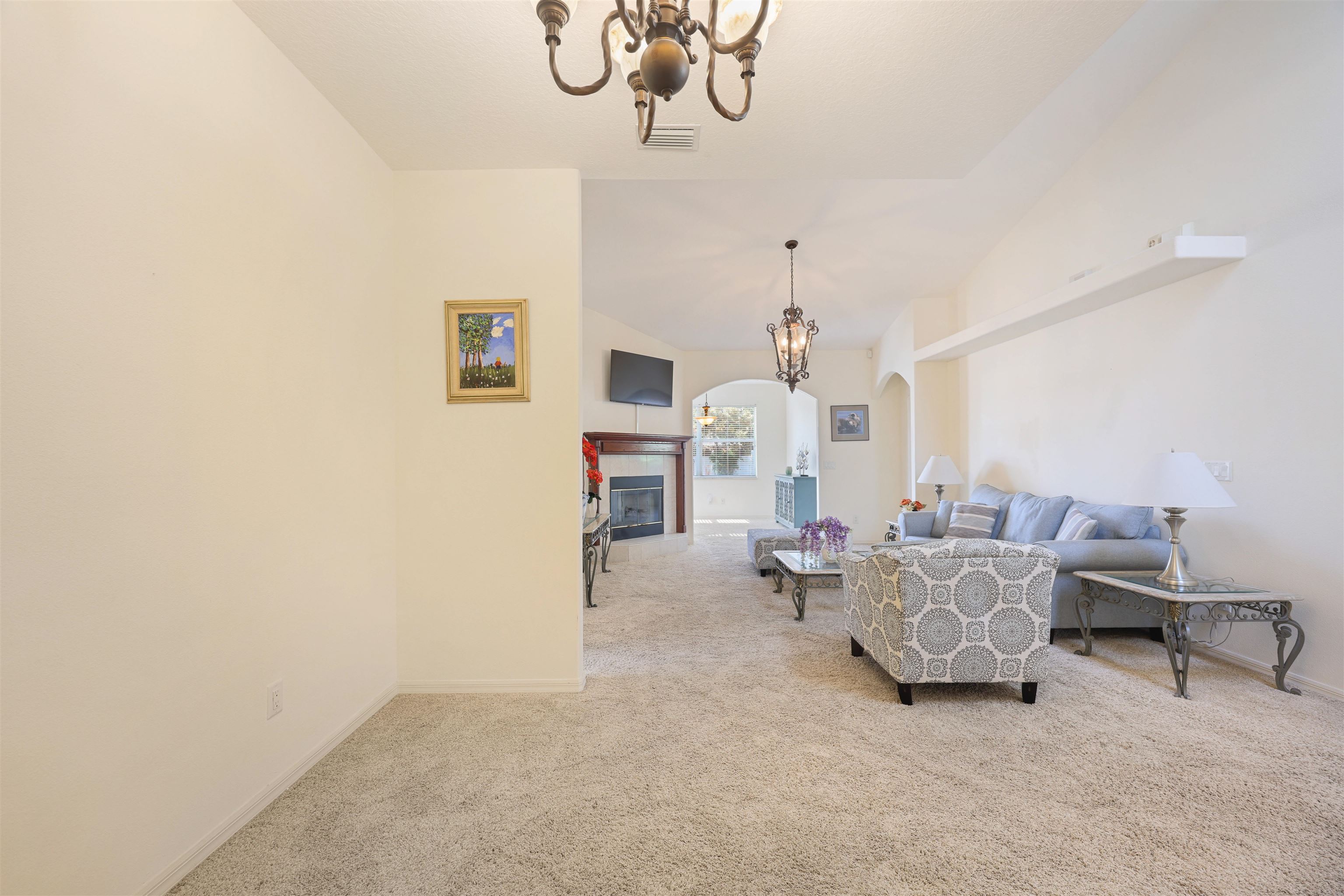 1017 Ridgewood Lane St. Augustine, FL 32086 - Photo 15 of 43 a living room with furniture and a chandelier
