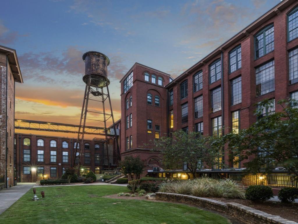 a front view of a building with garden